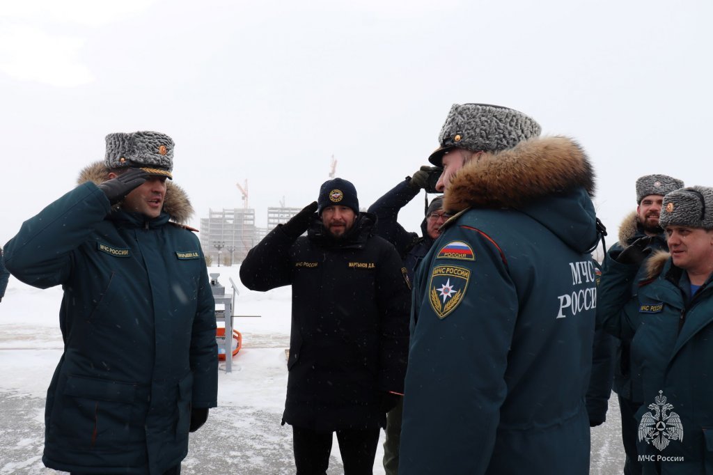 Emergency service representatives and a fire vehicle at the Arctic 2023 event